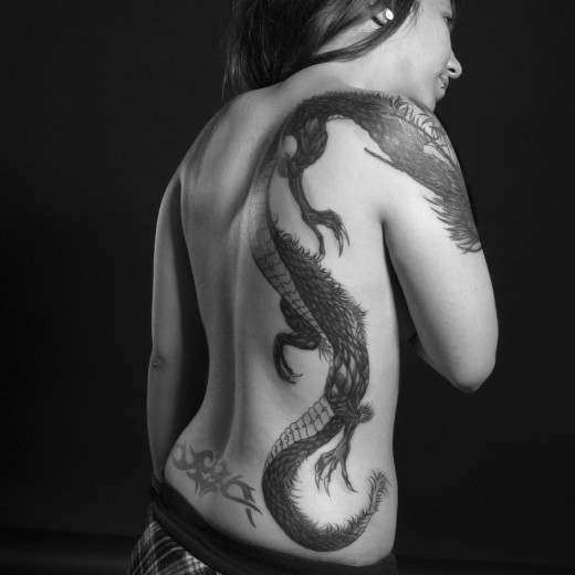 tribal tattoos for men on side. Black Tribal Dragon Tattoos On
