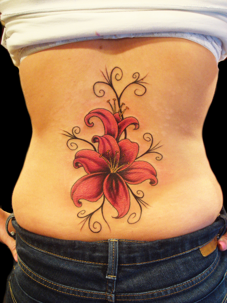 http://www.yusrablog.com/wp-content/uploads/2010/12/Lily-Flower-Tattoo-for-Girls-Back.jpg