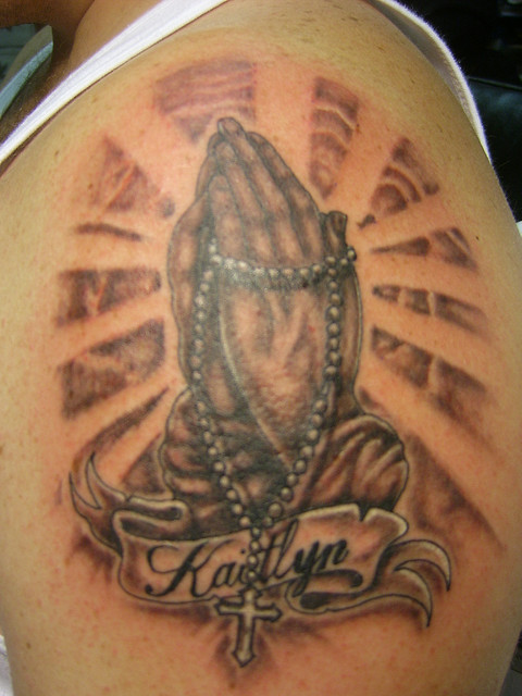 praying hands tattoo. Praying Hands Tattoo