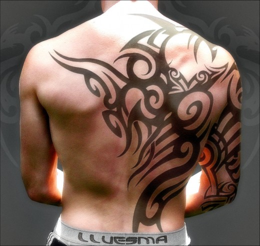 http://www.yusrablog.com/wp-content/uploads/2011/01/Awesome-Upper-Back-Tribal-Tattoo-Design-2011-520x492.jpg