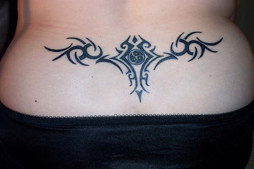 girly back tattoos. lower ack tattoo designs for