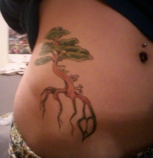 ribs tattoo female. New 2011 Tree Tattoo Design on