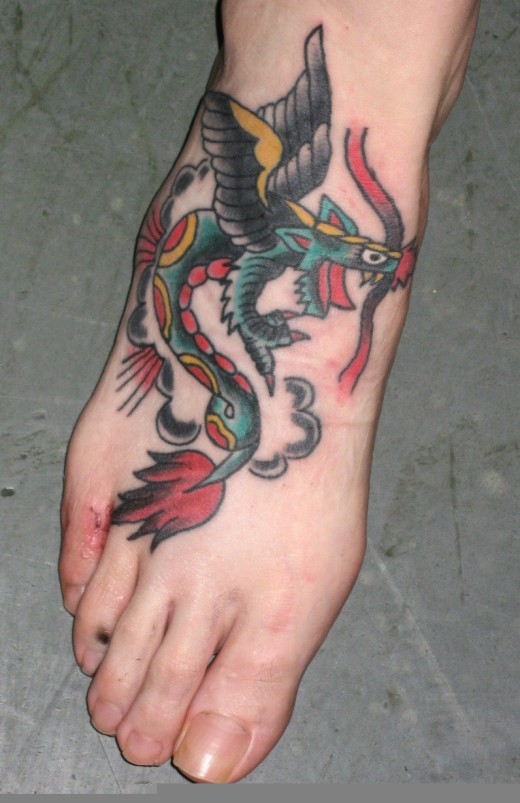 tattoos on foot for girls. Colorful Dragon Foot Tattoo