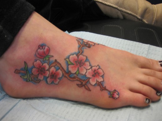 Tattoos On Feet For Women. Flower Tattoo on Foot for
