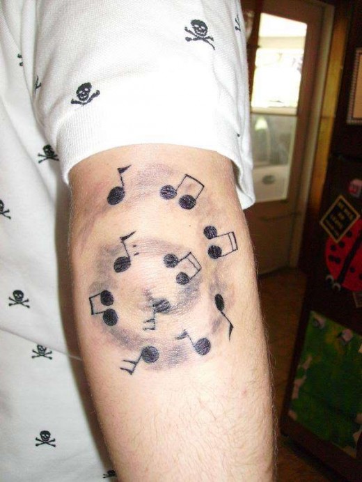 music tattoos ideas for guys. Music Elbow Tattoo Design for Men 2011