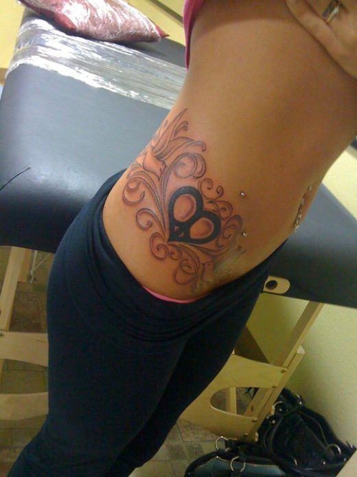 tattoos for women on side. Women Side Tattoo Design Fashion 2011