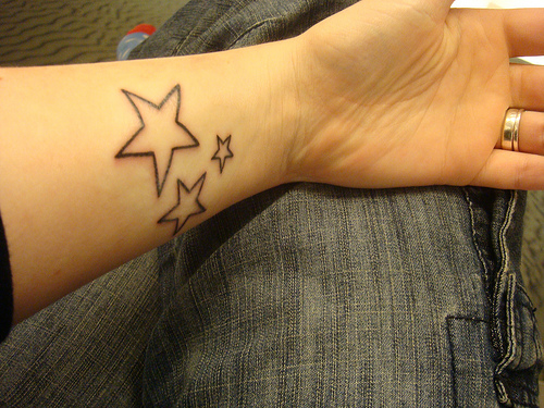 Pictures Of Star Tattoos On Feet. stars tattoos on foot.